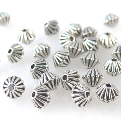 35 Metallperlen Spacer Bicone 4mm Metall Perlen geriffelt altsilber  -1277