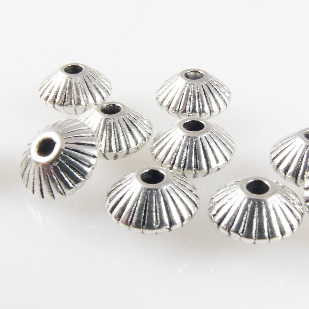 10 Metallperlen Spacer Bicone 5x7,5mm Metallrondelle geriffelt altsilber  -1759