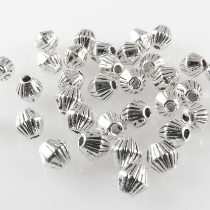 35 Metallperlen Doppelkegel 4mm Metall Spacer Perlen altsilber  -1761